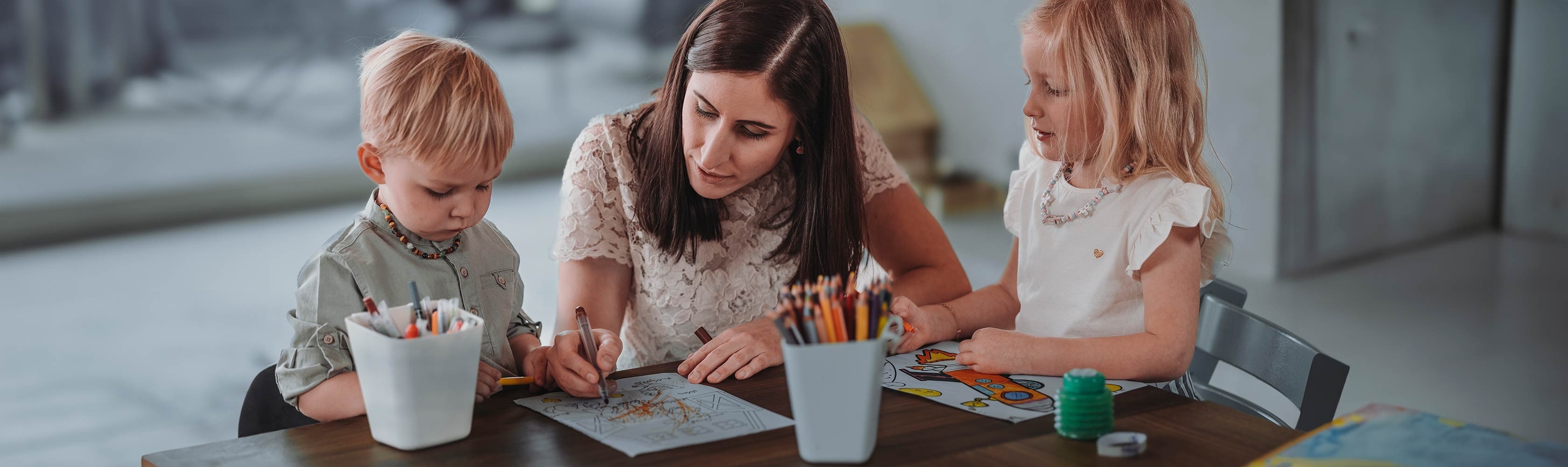 General questions - father and daughter examine a flower with a magnifying glass