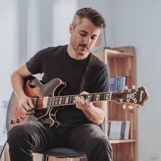 Life situations - A man wearing sportswear is sitting on a stone
