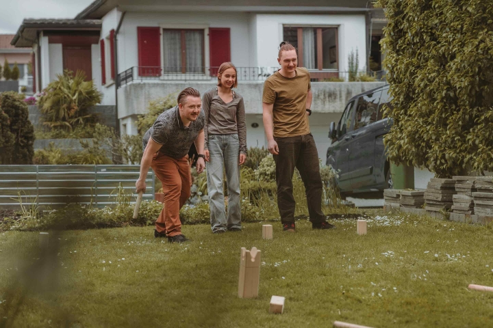 Insurance for my family – family enjoying a game together in the garden