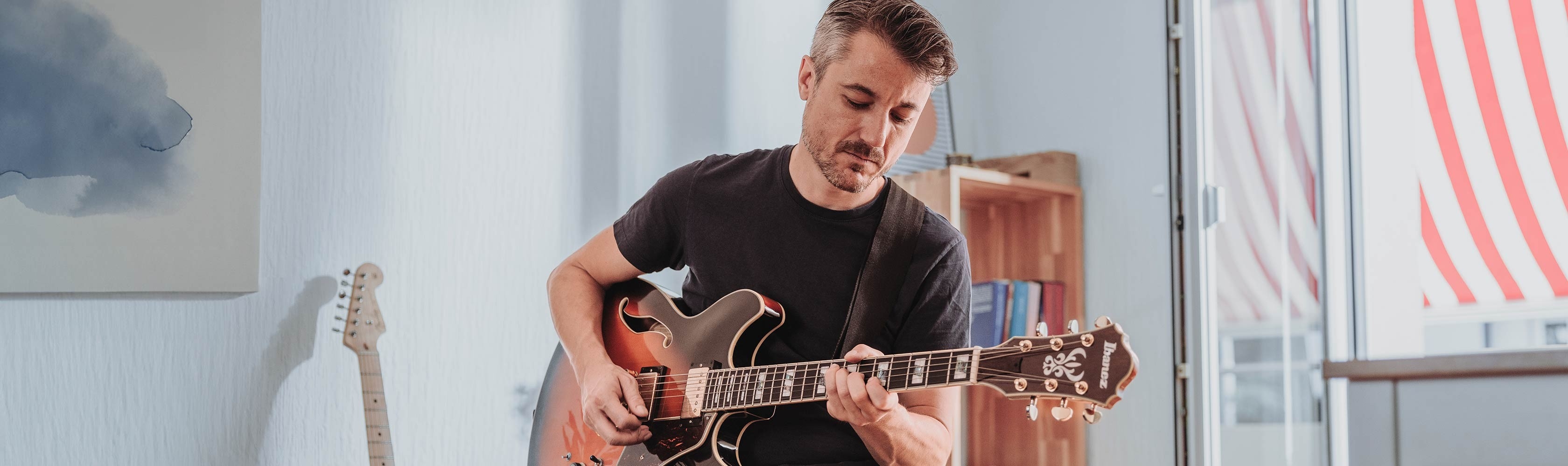 Myself - A man wearing sportswear is sitting on a stone